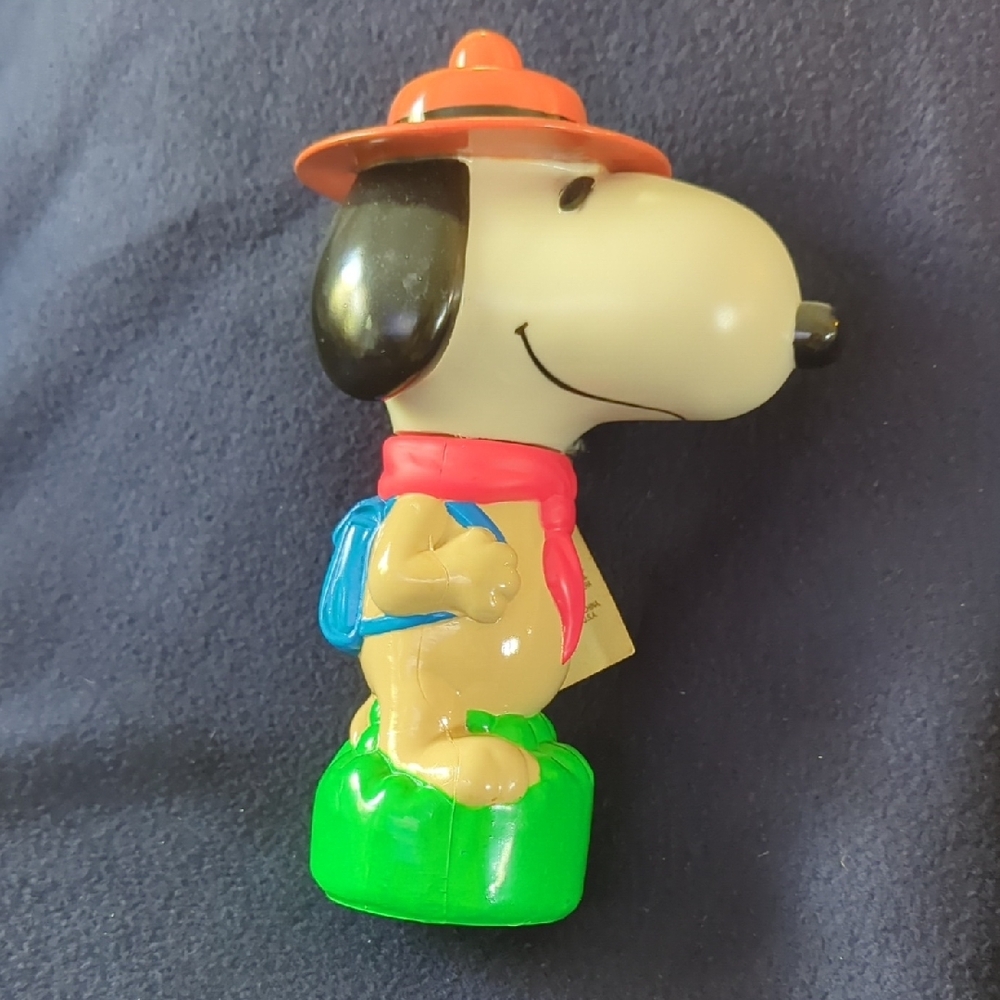 Snoopy Figurine with Orange Hat and Green Base